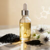 Black seed oil in a glass dropper bottle with Nigella sativa seeds, showcasing natural skincare ingredient for acne and hydration.